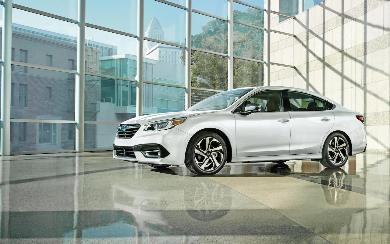 A 2022 Subaru Legacy Touring XT parked in a modern building.